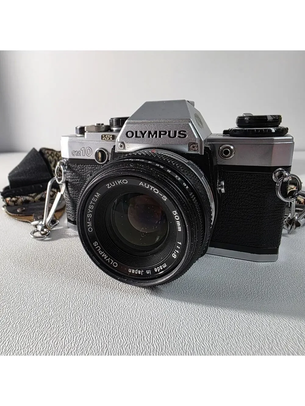Olympus OM10 With Zuiko 50mm F1.8 Lens W/Neck Strap & Manual